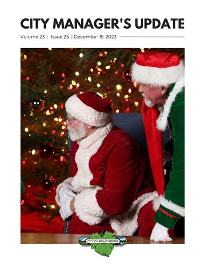 The Cover of the Healdsburg City Manager's Update. Santa and his elf sitting in front of a green tree