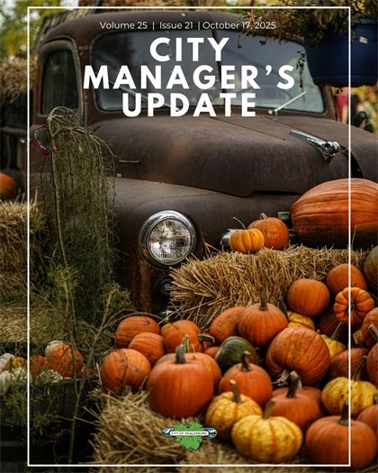 The cover of the Healdsburg City Manager's Update. A brown truck in the background with a stack of hay and pumpkins in the front.